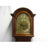 An Edwardian period mahogany grandmother clock with three train striking and chiming movement,