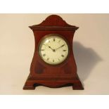 An Edwardian mahogany and strung inlaid timepiece with enamelled Roman dial,