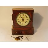 A late 19th Century walnut and brass inlaid mantel clock,