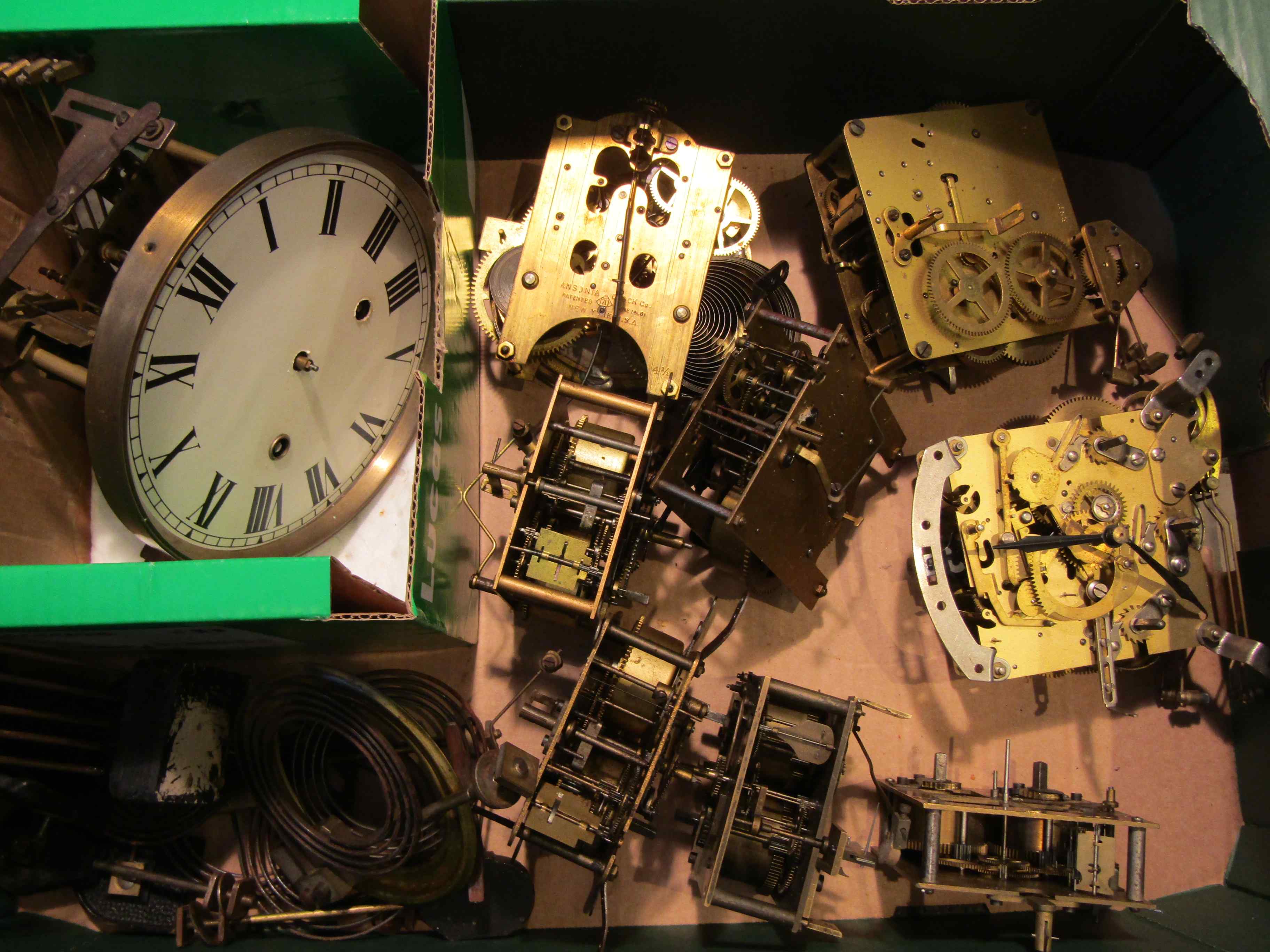 A box of striking/chiming clock movements,