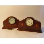 Two Edwardian mahogany and satin inlaid desk timepieces, one with brass columns,