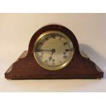 An early to mid 20th Century oak Napoleon hat mantel clock, silvered Roman dial signed J. W.