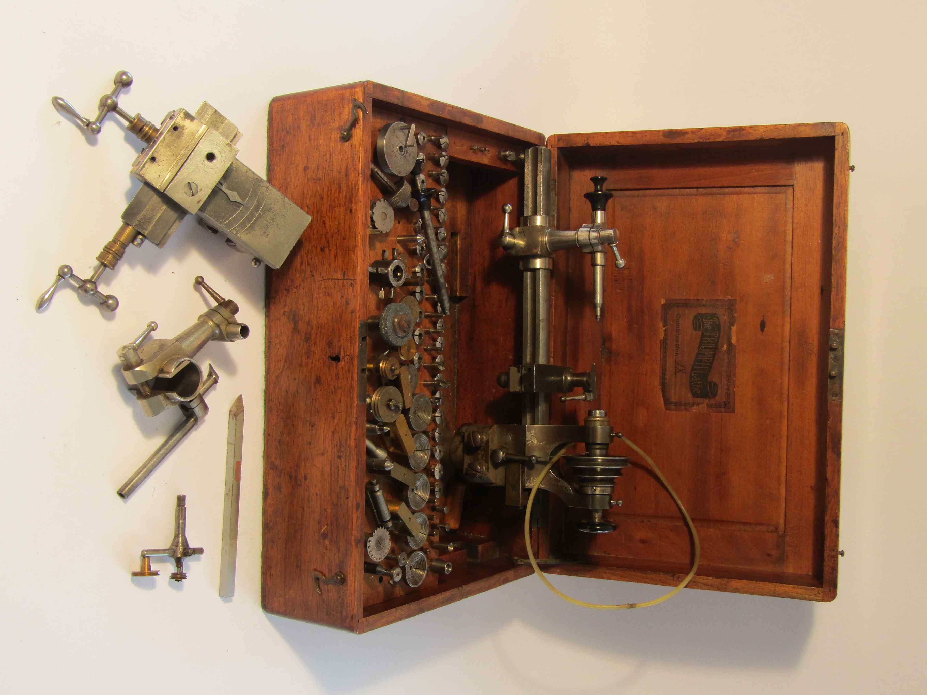 A boxed early to mid 20th Century 6mm watchmaker's lathe,