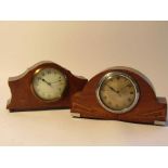 Two early 20th Century walnut and mahogany desk timepieces with French drum movements,