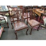 A set of four Waring and Gillows retailed Georgian style mahogany dining chairs with leather drop