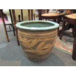 A green ground planter with dragon design, 41cm tall,