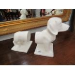 A white ceramic pair of Dachshund dog form book-ends