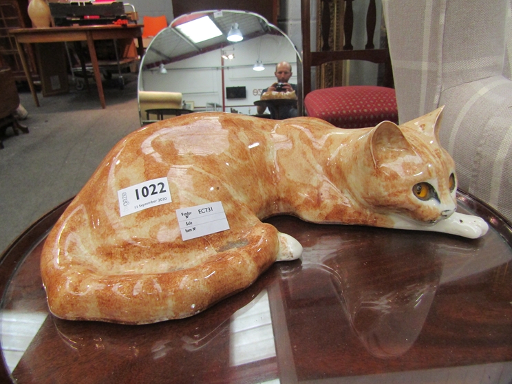 A Winstanley recumbent ginger cat