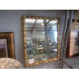 A gilt dressing table easel-back mirror