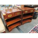 A pair of reproduction mahogany bedside cabinets in the campaign style,