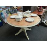A painted modern pine extending circular breakfast table,