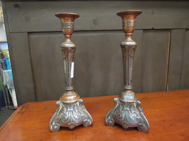 A pair of Art Nouveau silver plated on copper candlesticks,