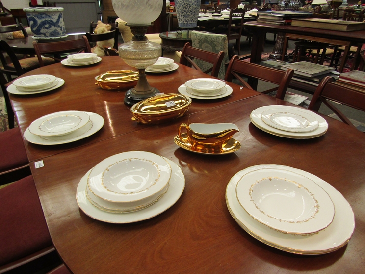 A quantity of Royal Worcester Gold Chantilly dinner wares with gilded tureens and gravy boat