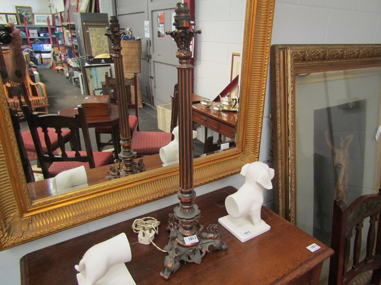 A coppered effect table lamp base with three seahorses to base