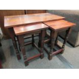 A flame mahogany nest of three tables