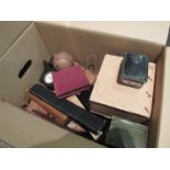 A box of miscellaneous bygones including vintage cricket ball,