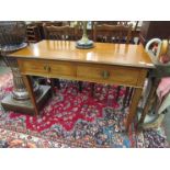 An Edwardian mahogany side table with two cross-banded frieze drawers