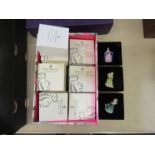 A box of ten Royal Doulton miniature ladies all boxed with display stand