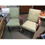A pair of bentwood bedroom chairs with green foliate upholstery