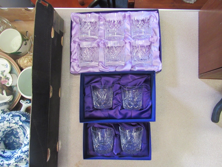 A boxed matched set of Edinburgh crystal whisky tumblers and two other smaller sets