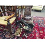 A copper coal scuttle and a selection of fire tools etc