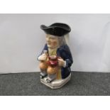 A late 18th early 19th Century Toby jug with figural handle.