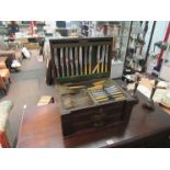 An early 20th Century part canteen of cutlery lift top with two drawers