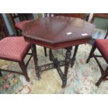An early 20th Century walnut octagonal top occasional table, fret work base,