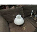 A Victorian brass ceiling hanging oil lamp with white glass shade and Veritas burner