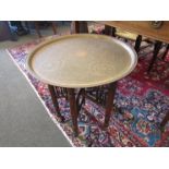 An Indian brass top folding occasional table,