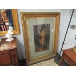 A pair of large gilt gesso picture frames with prints of ladies,