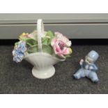 A Royal Doulton china basket of flowers and a miniature china Dutch Boy figure (2)