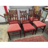 A set of six Arts & Crafts era dining chairs with embossed copper back panels,