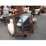 An Edwardian mahogany glazed corner wall cabinet,