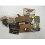 A mixed selection of items including AA badge, vintage razor, cigarette cards, Players Airman tin,