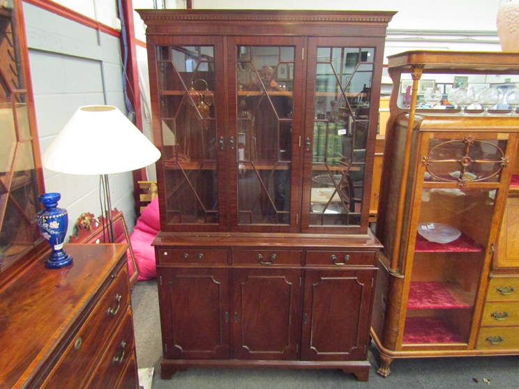 An astragal glazed top over three drawer display cabinet,