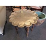 An Indian brass top coffee table with bamboo base,