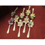 Nine Capodimonte spoons with applied floral design