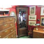 A Georgian mahogany tall corner cupboard with glazed door over cupboard door, 224cm tall,