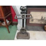 A cast iron umbrella stand,