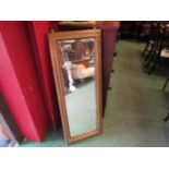 A gilt framed wall mirror