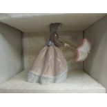 A Lladro figurine of girl with parasol,