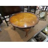A circa 1920 burr walnut occasional table the pie crust edge top over cabriole leg supports,