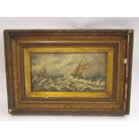 A gilt framed oil on board depicting ships at sea, monogram lower right,