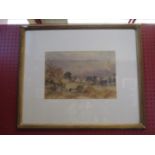 A framed and glazed watercolour of cows in landscape with Church beyond,