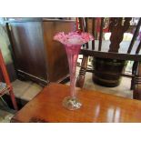 A tall Victorian cranberry/vaseline glass trumpet vase,