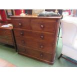 A Victorian mahogany chest of two over three drawers, bun handles, plinth base,