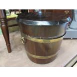 A Drummond Woodware mahogany coal/stick bucket, with brass banding and twin handles,