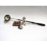 A punch ladle, pepperette, cow paperweight and sovereign case,