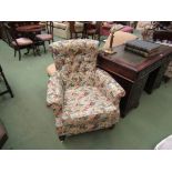 A pair of Edwardian Howard/Shoolbred style country house armchairs with sprung front edge on ring